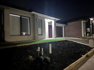 a garden in front of a house at night at Stockmans in Truganina