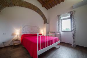 เตียงในห้องที่ Agriturismo Sensi