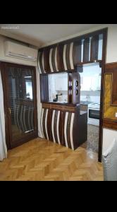 a room with a kitchen and a living room at Sashka appartments in Gevgelija