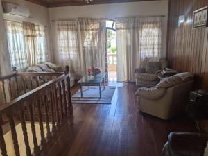 a living room with a couch and a table at Brookville in Georgetown
