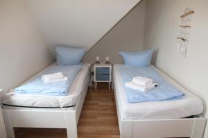 Ένα ή περισσότερα κρεβάτια σε δωμάτιο στο Friesennest