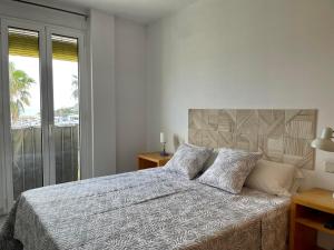 Postel nebo postele na pokoji v ubytování Apartamentos Port Marina