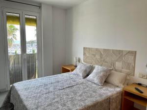 Postel nebo postele na pokoji v ubytování Apartamentos Port Marina
