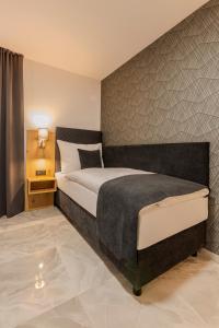 Ένα ή περισσότερα κρεβάτια σε δωμάτιο στο Hotel Tříška