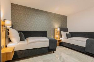 Ένα ή περισσότερα κρεβάτια σε δωμάτιο στο Hotel Tříška