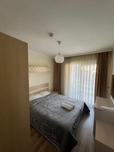 Postel nebo postele na pokoji v ubytování Agartha Suite Hotel Kemer
