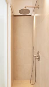 a shower with a shower head in a bathroom at PALAZZO SAN ROCCO in Sperlonga +86 photos