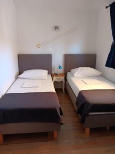 Postel nebo postele na pokoji v ubytování Apartments Emma