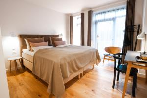 Voodi või voodid majutusasutuse Sixtus Sinatur Hotel & Konference toas