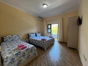 Voodi või voodid majutusasutuse Canary Hotel toas