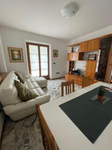 a living room with a couch and a table at Casa Valentina in Ledro