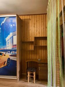 a room with a desk and a car on a window at U Bogdana in Yaremche