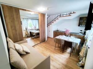 a living room with a couch and a table at Albergo Del Sole in Porto Valtravaglia