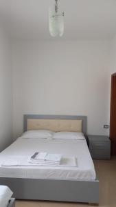 Postel nebo postele na pokoji v ubytování Bello Apartaments