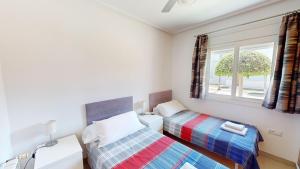 En eller flere senge i et værelse på Villa Chestnut - A Murcia Holiday Rentals Property + 45 billeder