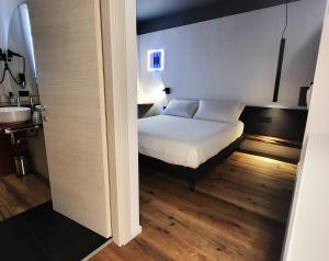Postel nebo postele na pokoji v ubytování AdisArtur Elegant B&B