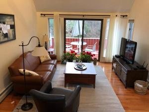 a living room with a couch and a coffee table at idream beautiful place by the sea in Ogunquit