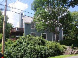 a house with a balcony on the side of the street at idream beautiful place by the sea in Ogunquit