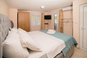 Postel nebo postele na pokoji v ubytování Monikas Village Appartments