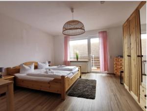 Postel nebo postele na pokoji v ubytování Hotel Wettlaufer