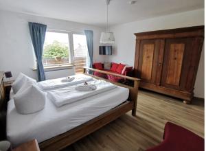 Postel nebo postele na pokoji v ubytování Hotel Wettlaufer