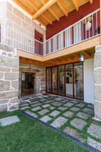 a patio of a house with a wooden roof at Casa da Bisa Rita in Aldeia Formosa +31 photos