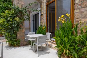 A garden outside Asterina Hotel
