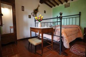 A bed or beds in a room at Agriturismo Biagiotti