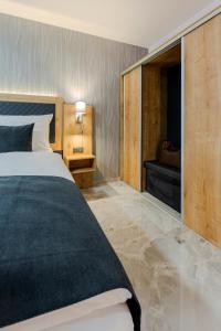 Ένα ή περισσότερα κρεβάτια σε δωμάτιο στο Hotel Tříška
