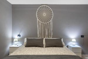 En eller flere senge i et værelse på Maison Bebe Comboé