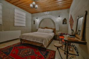 Postel nebo postele na pokoji v ubytování Asma Cave House + 10 fotografií