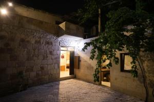 a door to a building at night at Asma Cave House in Göreme