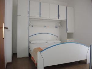 A bed or beds in a room at Condominio Sovego