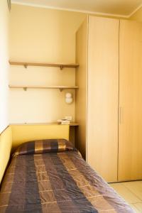 Postel nebo postele na pokoji v ubytování Aparthotel La Pineta