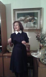 a woman in a black dress standing in a room at Casa Rachele in Piano di Sorrento