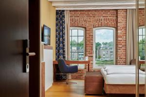 Postel nebo postele na pokoji v ubytování Hotel Hafenspeicher + 29 fotografií