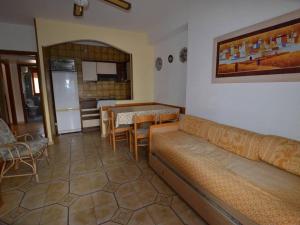 a living room with a couch and a table at Casa Vacanze Diamante - Parco del Sole in Diamante
