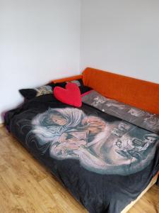 a bed with a large painting of a man on it at Сихів Зелена Пасічна Новобудова ЖК Первоцвіт, Вулецька in Lviv