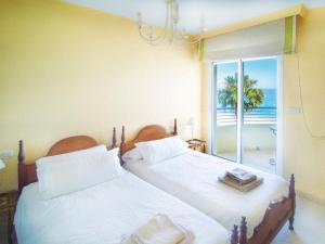 Postel nebo postele na pokoji v ubytování Banana Beach + 37 fotografií