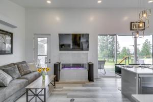 a living room with a couch and a fireplace at Hot Tub and Views Sunset Valley Retreat in Eureka in Eureka