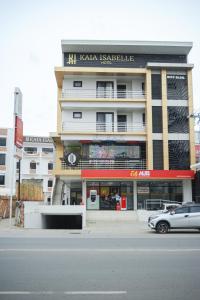 a building with a car parked in front of it at Kaia Isabelle Hotel Puerto Princesa in Puerto Princesa City +20 photos