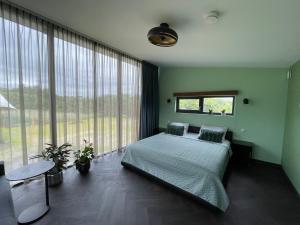 Postel nebo postele na pokoji v ubytování Casitas Wijchen