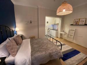 a bedroom with a bed and a living room at Sapphire Suites Taksim in Istanbul