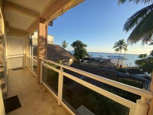 a balcony with a view of the ocean at Kokoloko in Ambatoloaka