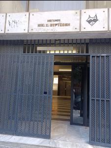 an entrance to a building with an open door at Exclusive ladadika apartment 1 in Thessaloniki