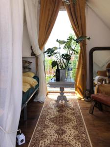 a bedroom with a bed and a rug on the floor at Captivating Studio Apartment in Mexilhoeira Grande in Mexilhoeira Grande