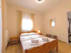 Postel nebo postele na pokoji v ubytování Corfiota Sourina