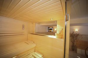 a sauna with wooden walls and a wooden ceiling at Telemark in Zermatt