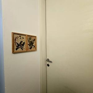 a door with a picture on top of it at Borgo Paradiso Guest House in Maccagno Inferiore
