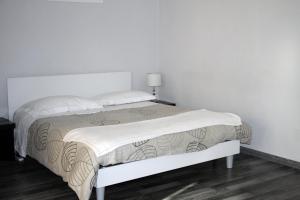 Postel nebo postele na pokoji v ubytování Le Muse
